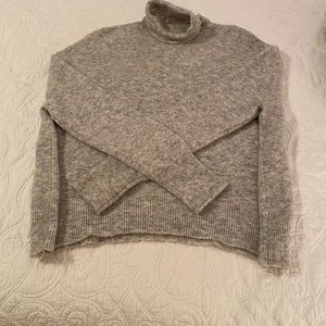 Turtleneck sweater.
